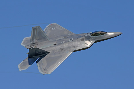 Flying gray jet plane