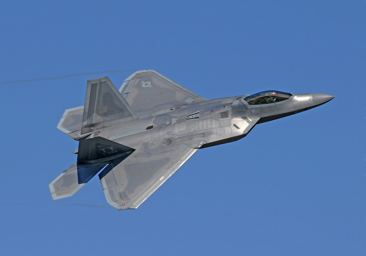 Flying gray jet plane
