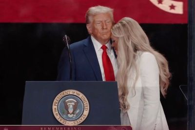Donald Trump embracing Erika Kirk