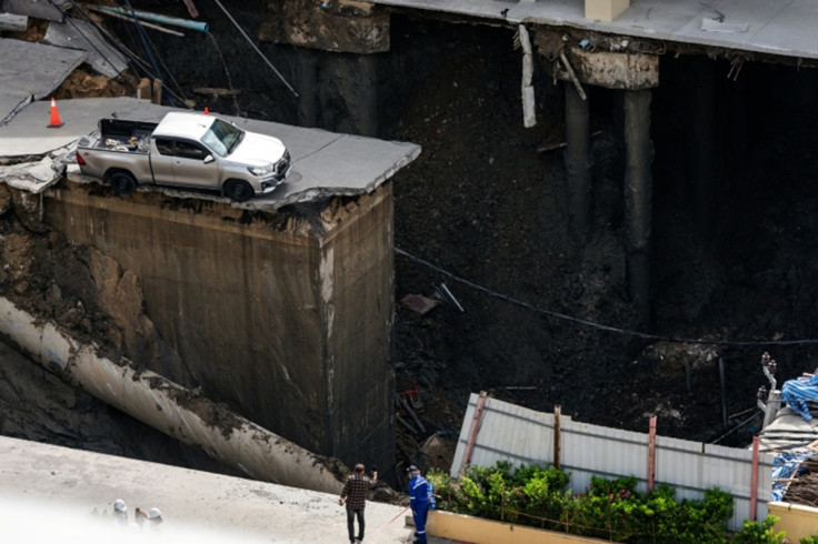 portion-busy-road-thai-capital-caved-leaving-massive-50-metre-deep-hole-front-main