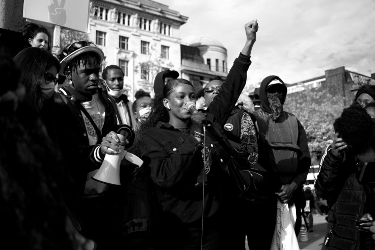A man and a woman in black jackets and hats