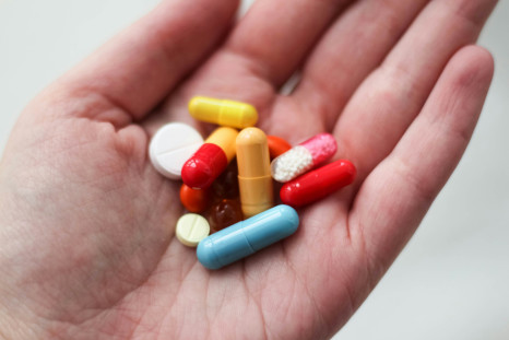 a medication pill in a person's hand