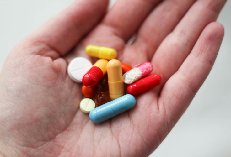 a medication pill in a person's hand