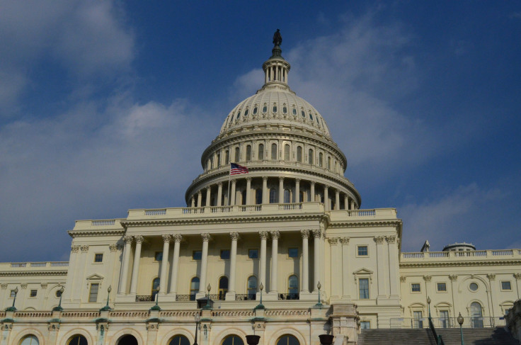 Us flag flying on the capitol building in washington dc.
