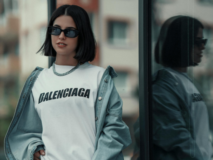 Model in a Balenciaga t-shirt and denims