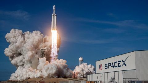 Rocket ship launching during daytime