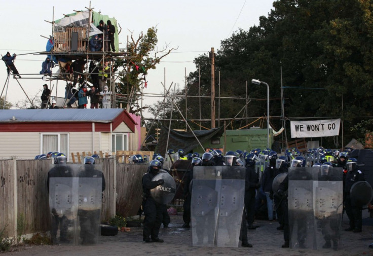 Police in riot gear prepare to move onto the Dale Farm Traveller site