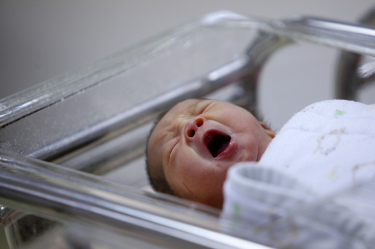 A baby yawns inside the maternity ward of a hospital in Taipei