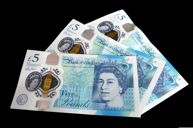 A pile of five-pound banknotes