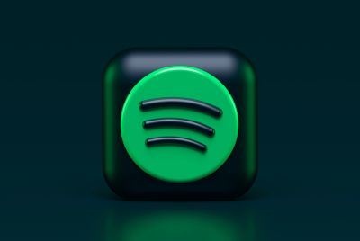 Spotify logo is lit up on a flat screen tv