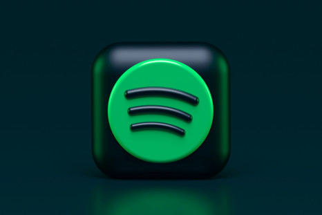 Spotify logo is lit up on a flat screen tv
