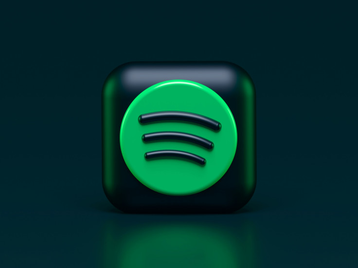 Spotify logo is lit up on a flat screen tv