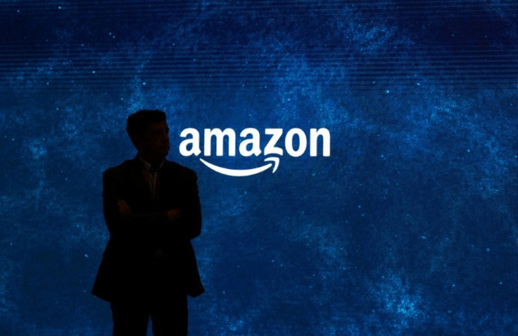 Man standing in front of Amazon logo
