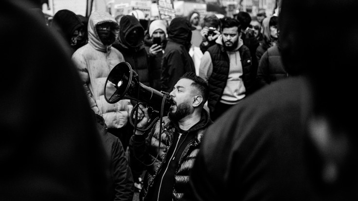whitechapel Community members stand at the front lines