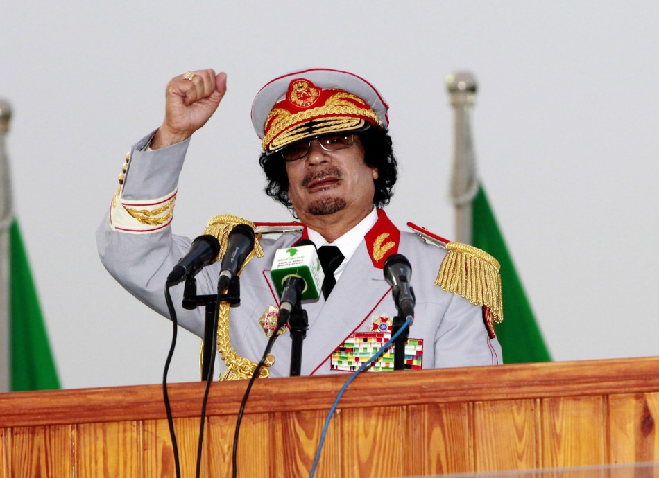 Libyan leader Moammar Gadhafi speaks during a ceremony to mark the 40th anniversary of the evacuation of the American military bases in the country, in Tripoli