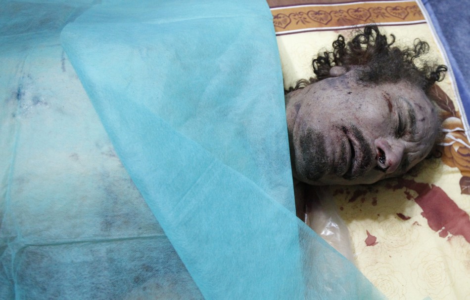 The body of Muammar Gaddafi is seen at a house in Misrata