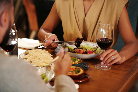 Couple in a restaurant eating dinner