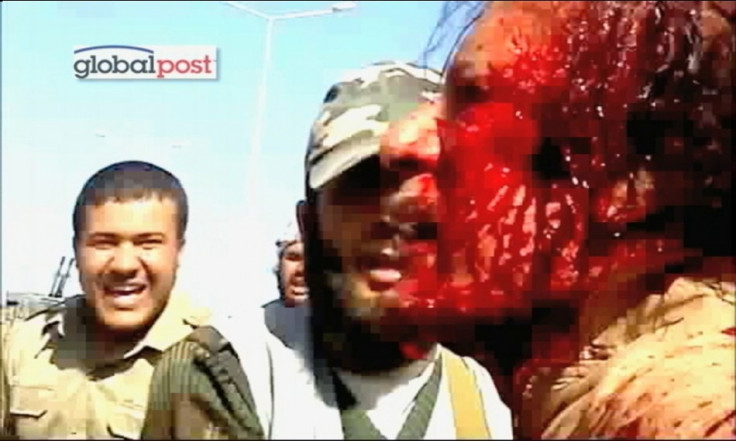 Frame grab shows former Libyan leader Muammar Gaddafi after his capture by NTC fighters in Sirte.