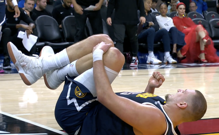 Nikolaj Jokic Down with an Injured Left Knee