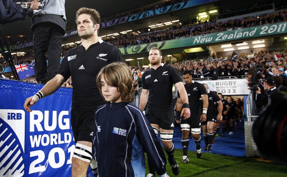 New Zealand All Blacks captain Richie McCaw leads his team onto the field before their Rugby World Cup final match against France at Eden Park in Auckland