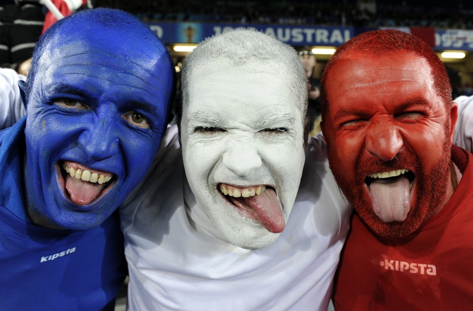 France supporters pose for a photo before the start of their Rugby World Cup final match against New Zealand All Blacks at Eden Park in Auckland.