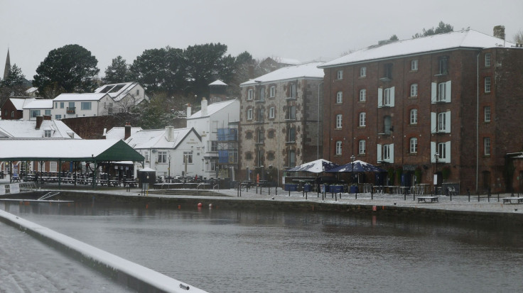 Snow blankets city streets as winter grips area