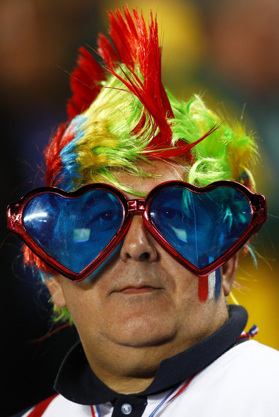 A France supporter waits for the start of their Rugby World Cup final match against New Zealand All Blacks at Eden Park in Auckland.