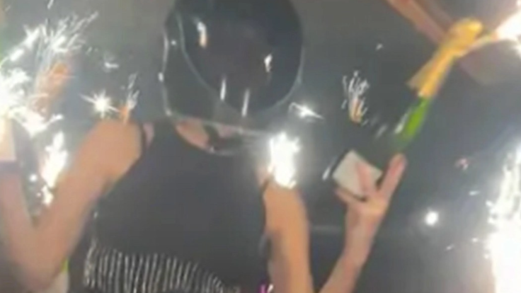 Waitress Cyane Panine allegedly holding sparklers prior the blaze