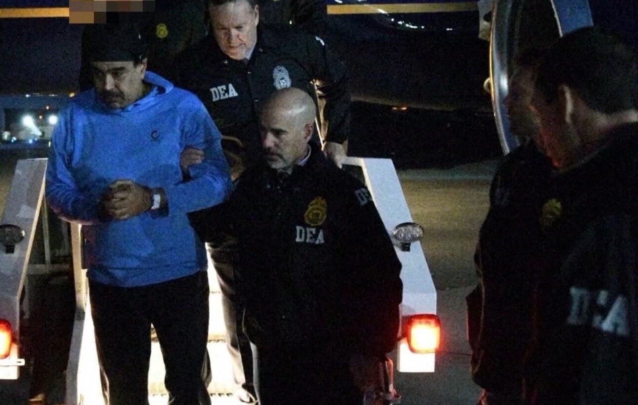 Nicols Maduro being escorted by the DEA