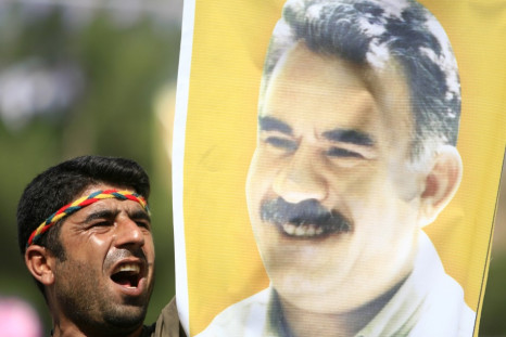 Kurdish man displays picture of PKK leader Abdullah Ocalan during
