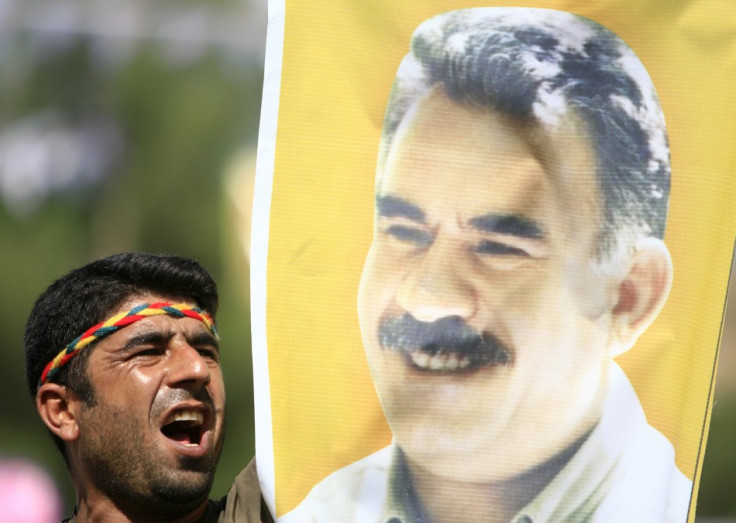 Kurdish man displays picture of PKK leader Abdullah Ocalan during