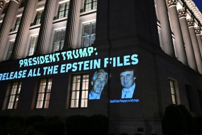 Signage saying 'President Trump: Release all the Epstein files'