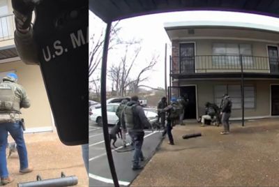 A federal agent is seen kicking a puppy in the