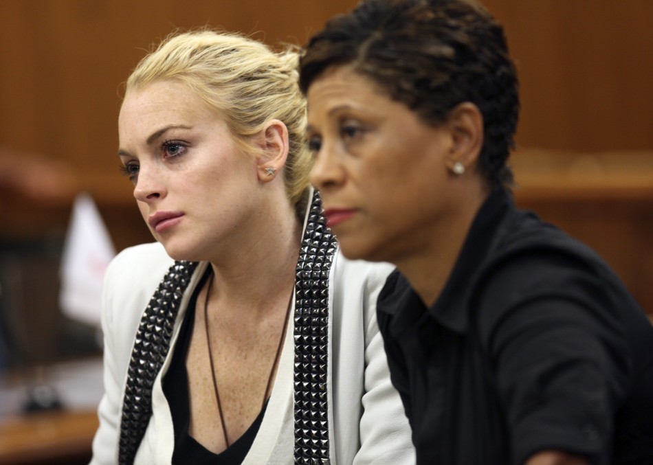 Lindsay Lohan and her lawyer Shawn Chapman Holley attend a progress report hearing