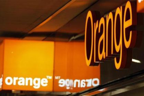 Logos of Orange are seen in front of an Orange France Telecom shop in Nice