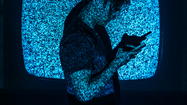 Using Phone Dark Stock Image