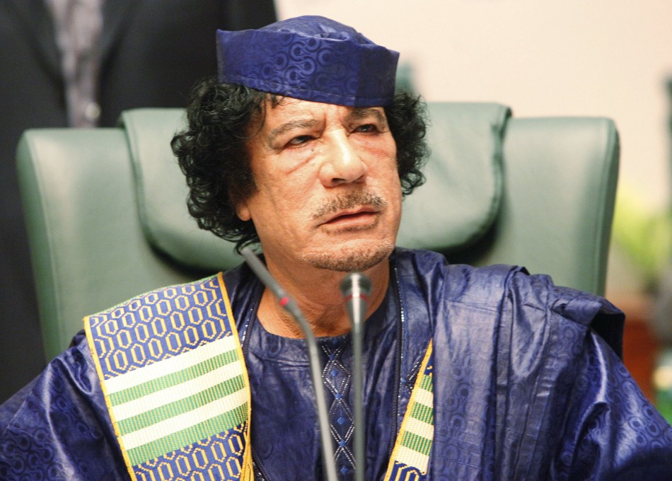 Libyan leader Muammar al-Gaddafi attends the closing session of the Arab League summit in Sirte