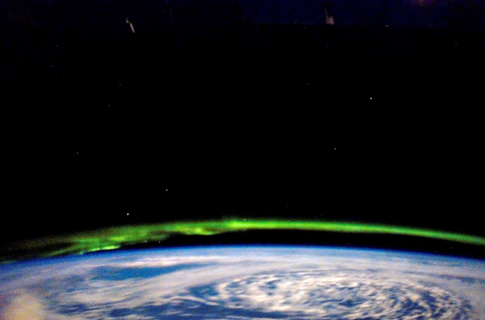 While docked and onboard the International Space Station, a STS-123 Endeavour crew member captures the glowing green beauty of the Aurora Borealis on March 21, 2008.