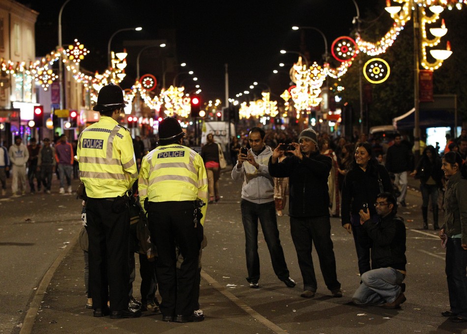 Children are photographed with British police officers during the Diwali celebrations in Leicester, central England on October 16, 2011. Diwali celebrations in Leicester are one of the biggest outside of India, with up to 35,000 people attending the switc
