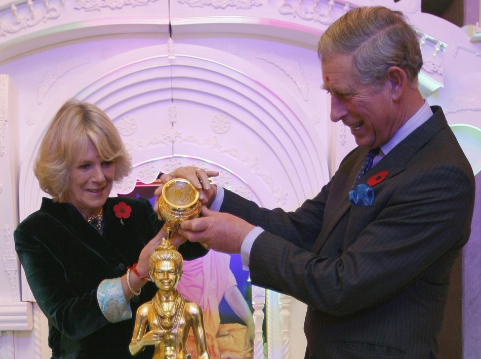 Britain039s Prince Charles and Camilla, Duchess of Cornwall left, pour holy water over the figure of a deity during their visit to the Shri Swaminarayan temple in northwest London on November 9, 2007. Britain039s Prince Charles and Camilla, Duches