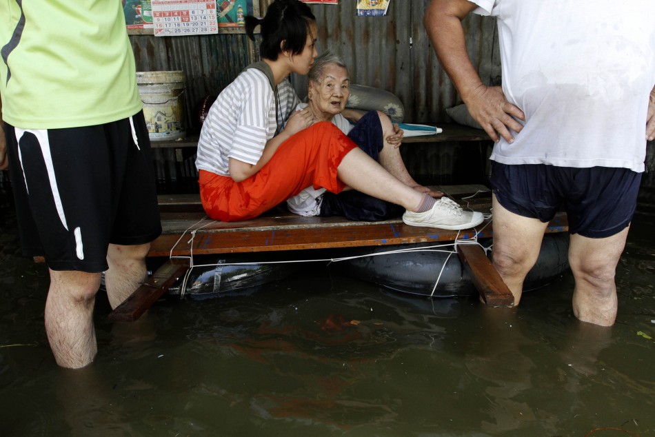 An elderly woman is evacuated as the floods advance into Bangkok An elderly woman is evacuated as the floods advance into Bangkok