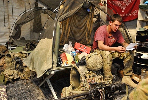 This photo of a soldier from 3rd Battalion, The Parachute Regiment, sitting in his bed