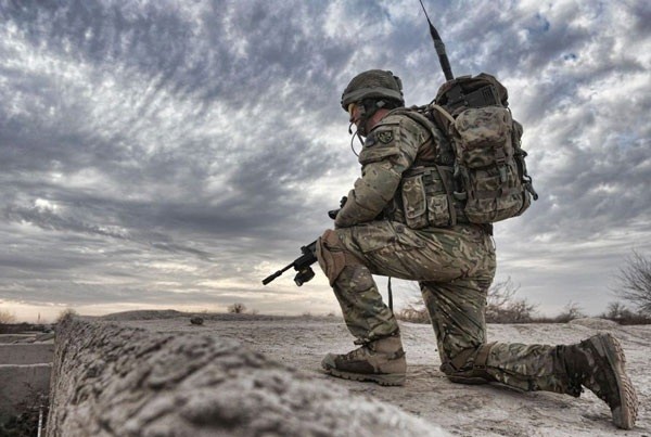 A soldier from 2nd Battalion The Parachute Regiment 2 PARA, observes from a compound roof near the town of Char Coucha, Afghanistan