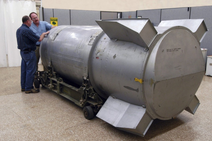 Workers examine a B53 nuclear bomb at B&W Pantex nuclear weapons storage facility outside Amarillo