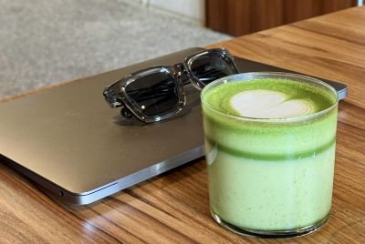 Matcha latte on the table in a coffee shop