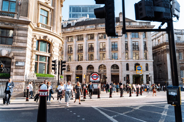 people walking on a busy cross street