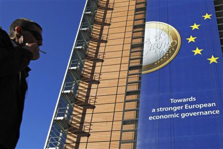A banner featuring a Euro coin is seen on the European Commission headquarters building ahead of a European Union heads of state summit in Brussels