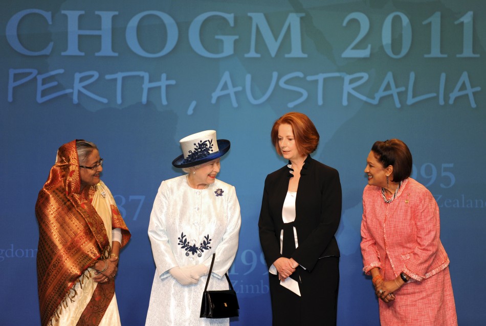 Britains Queen Elizabeth smiles next to Bangladeshs PM Sheikh Hasina, Australias PM Julia Gillard and Trinidad and Tobagos PM Kamla Persad-Bissessar at CHOGM in Perth