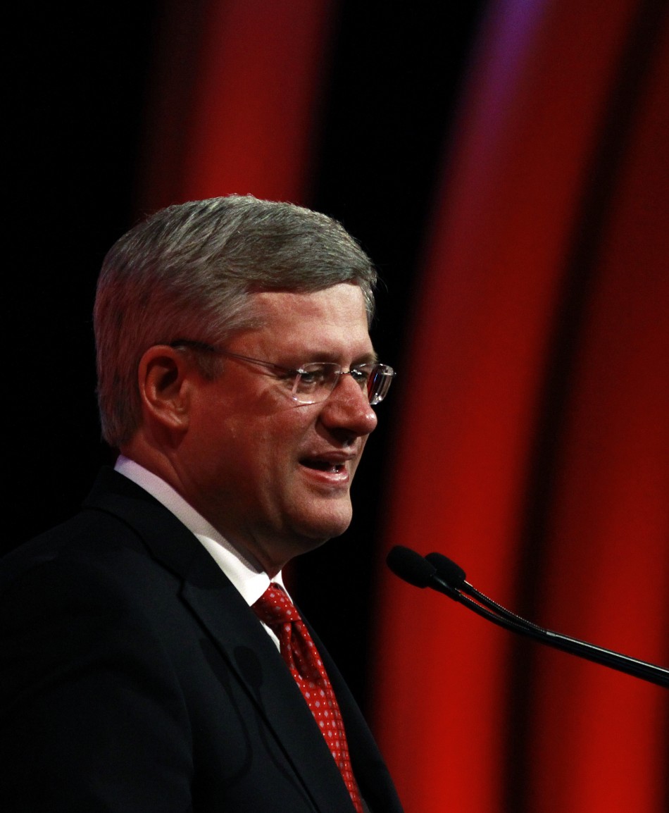 Canadas PM Stephen Harper gives a speech during the concluding session at a pre-summit business forum ahead of the CHOGM in Perth