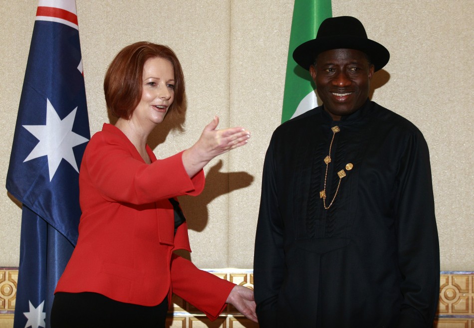 Australian Prime Minister Gillard gestures to Nigerian President Jonathan during a bilateral summit ahead of CHOGM in Perth